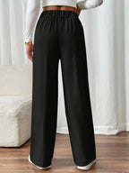 Pantalon met hoge taille en decoratieve knoopdetails