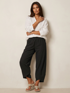 Broek met losvallende pijpen en elastische taille in zwart