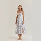 Bustier midi jurk met bloemenprint en split in blauw
