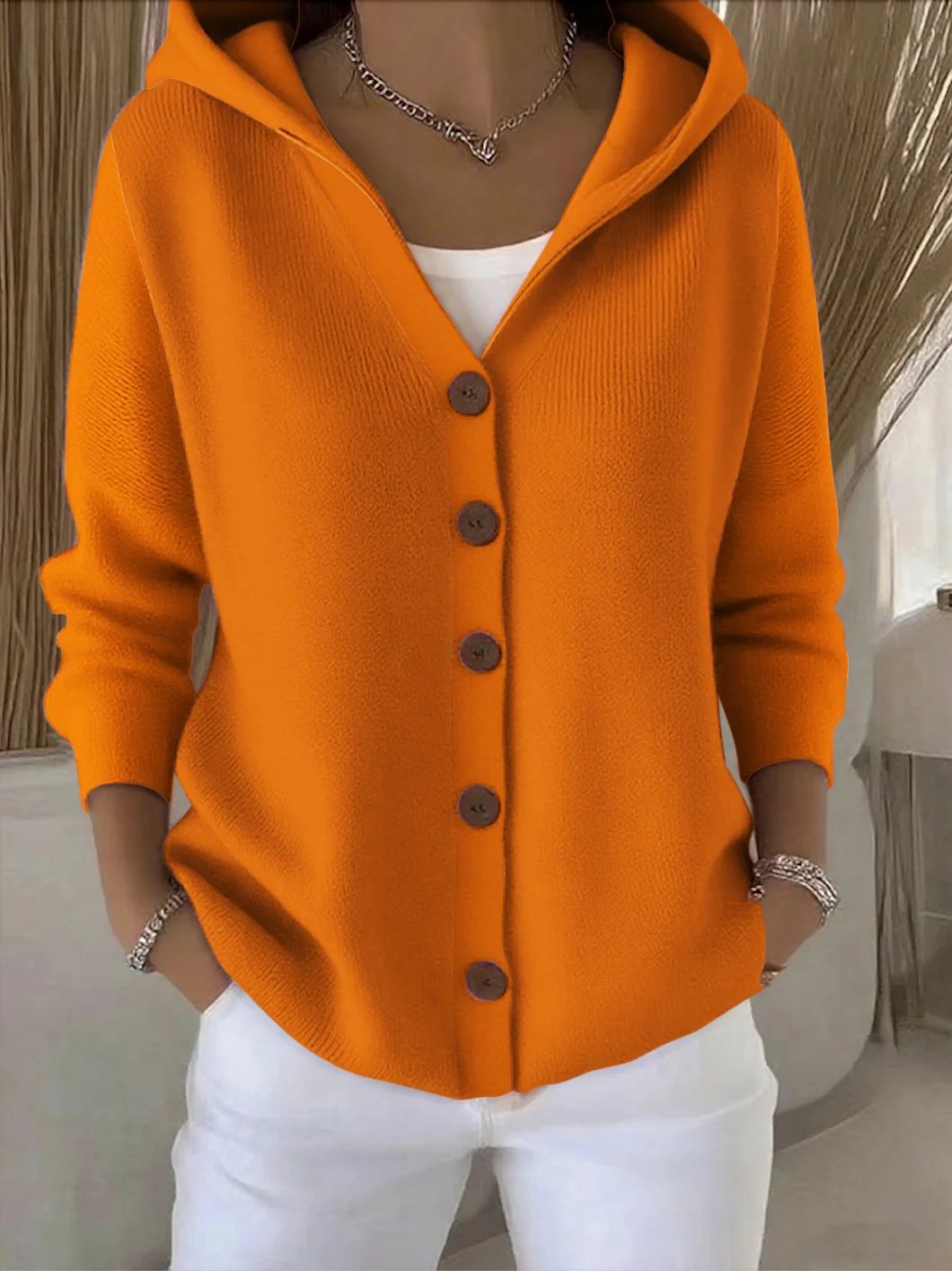 Gebreid vest met capuchon en knoopsluiting voor dames in oranje