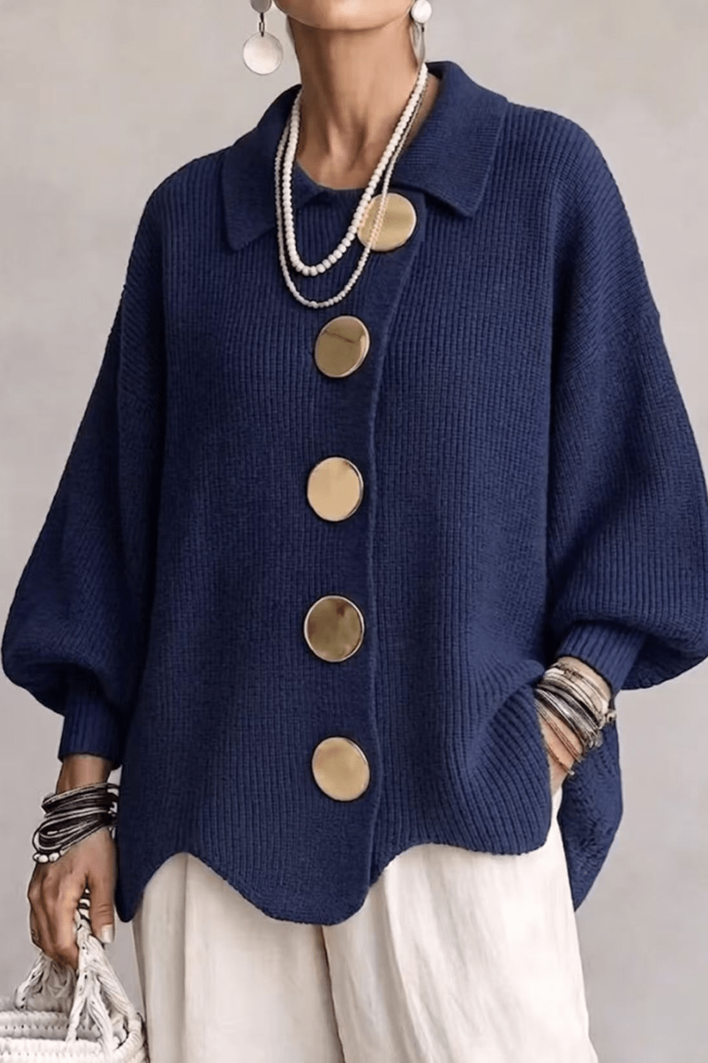 Gebreid vest met goudkleurige knopen en puntkraag voor dames in blauw
