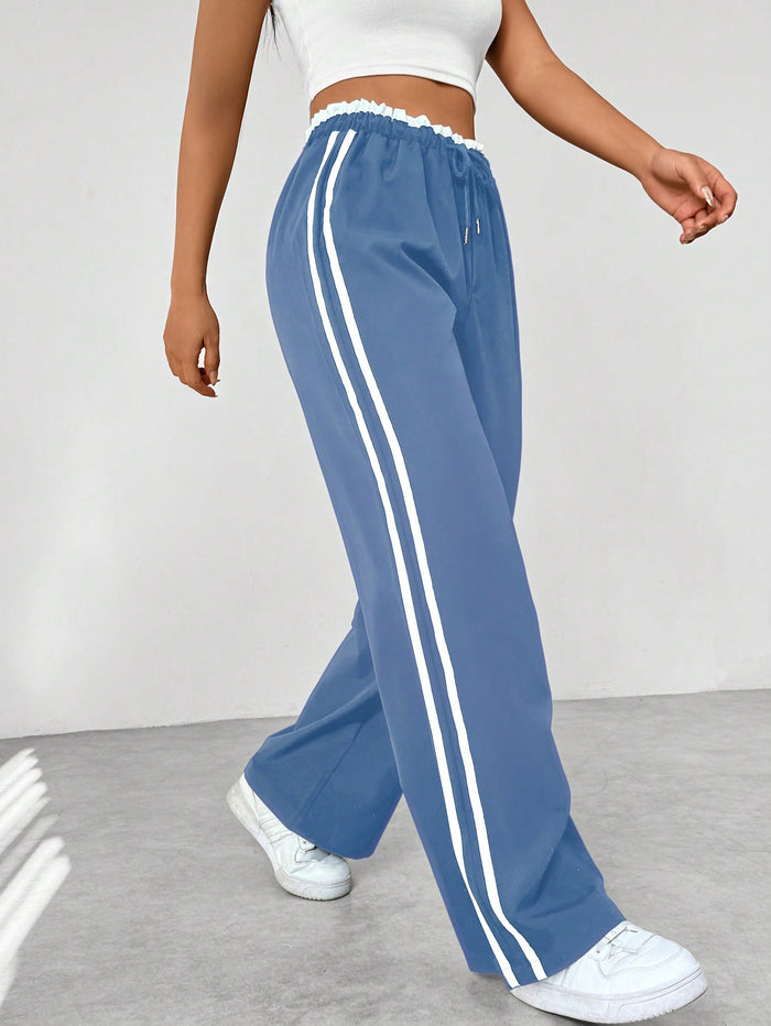 Joggingbroek met hoge taille en contrasterende zijstrepen voor dames in babyblauw