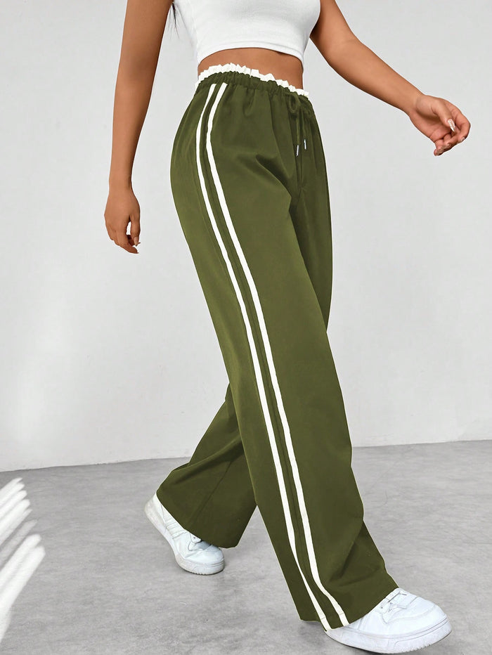 Joggingbroek met hoge taille en contrasterende zijstrepen voor dames in legergroen
