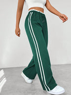 Joggingbroek met hoge taille en contrasterende zijstrepen voor dames in donkergroen