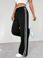Joggingbroek met hoge taille en contrasterende zijstrepen voor dames in zwart
