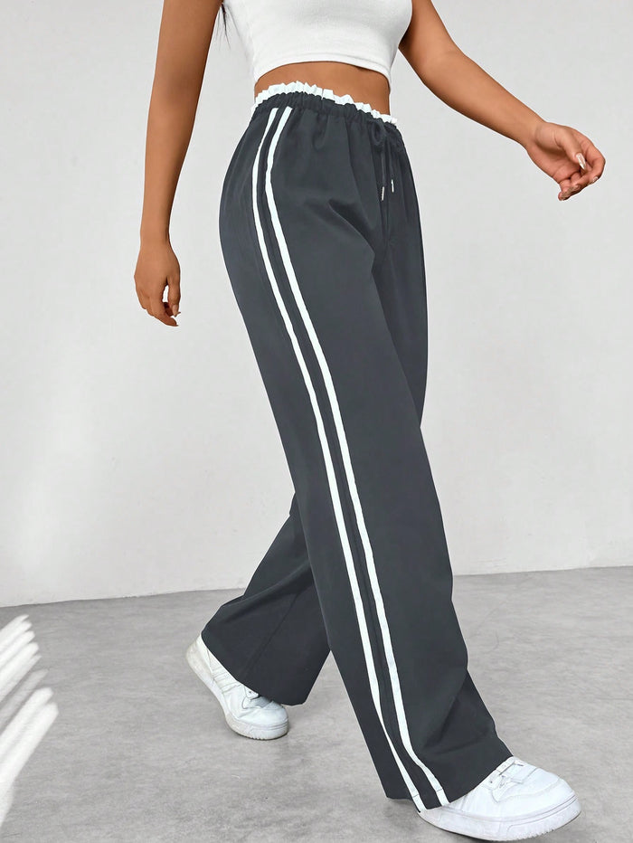 Joggingbroek met hoge taille en contrasterende zijstrepen voor dames in grijs