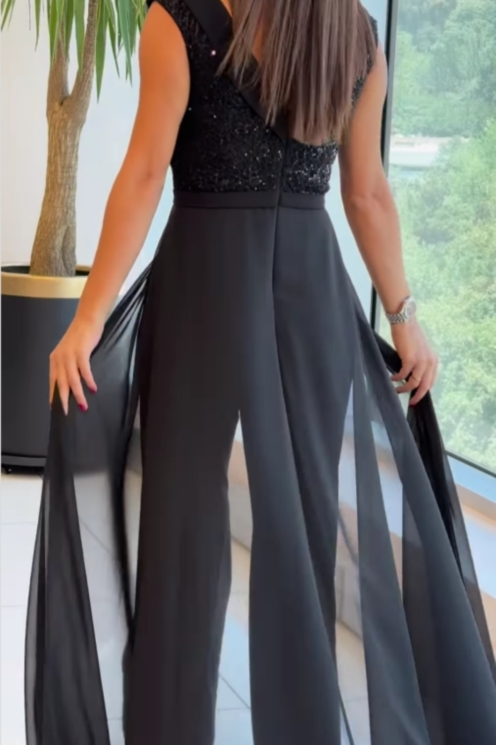 Mouwloze jumpsuit met getextureerde stof voor dames in zwart
