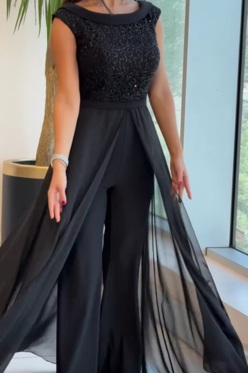 Mouwloze jumpsuit met getextureerde stof voor dames in zwart