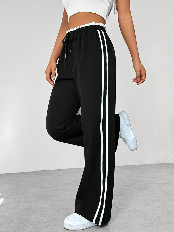 Sportbroek met zijstrepen en elastische taille voor dames in zwart