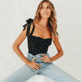 Top met stippenprint en strikbandjes in zwart