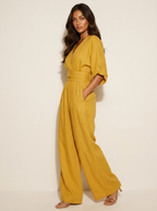 Wide-leg jumpsuit met V-hals en brede tailleband voor dames