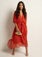 Maxi jurk met V-hals en strikdetail in oranje