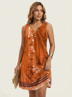 Zomerjurk met artistieke print en V-hals in oranje